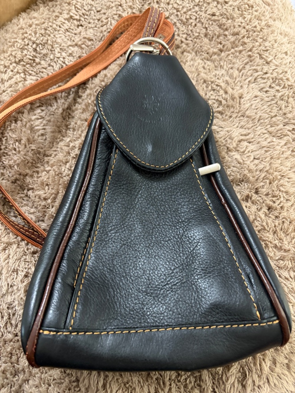 Woman’s Black Leather Sling Bag with Brown Accents